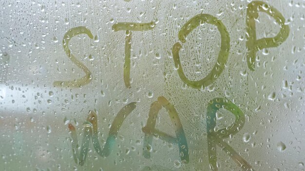 Photo inscription stop war on fogged glass