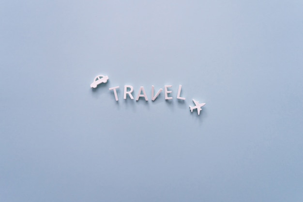 Photo inscription travel from letters isolated on blue