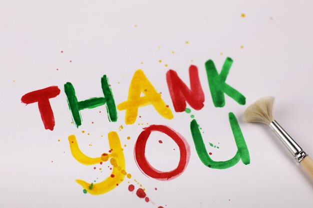 inscription on a white sheet of paper with watercolors "Thank you"