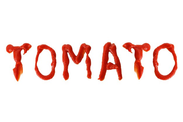 Надпись с томатным кетчупом TOMATO на белом фоне Фото высокого качества