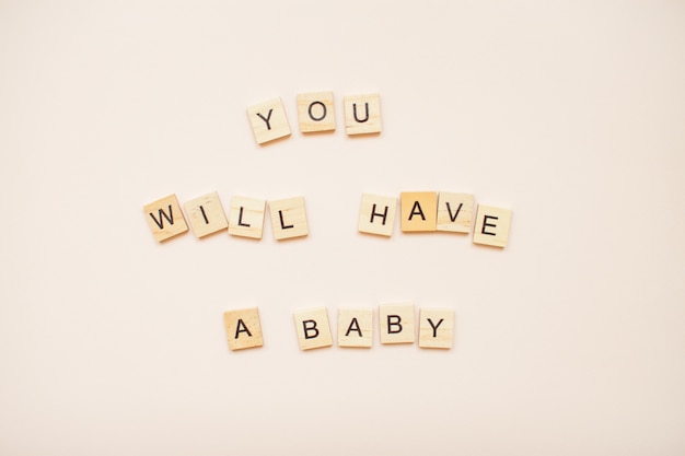 The inscription "you will have a baby"