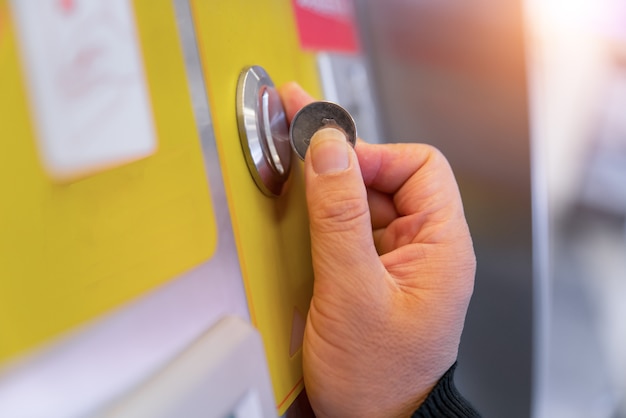 Inserting coin in to a vending machine