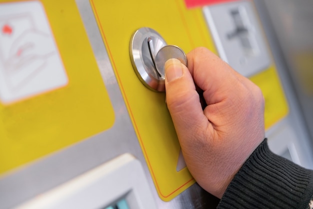 Inserting coin in to a vending machine