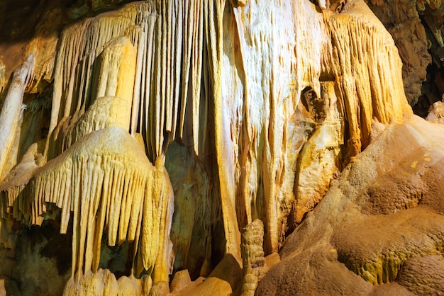 Inside of beautiful old dark cave with many stalactites. Grotte di Is Zuddas, Italy, Sardinia