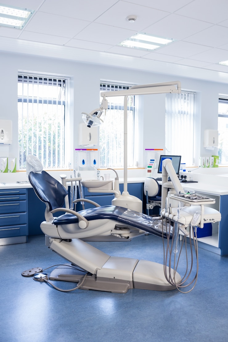 Photo inside of the clinic with dentists chairs, computer and tools