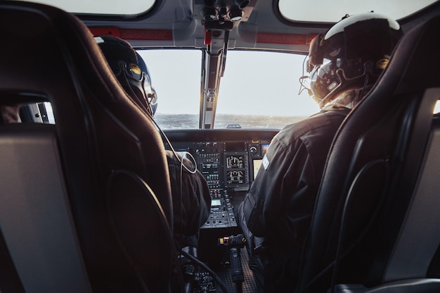 Inside the cockpit of a helicopter in fli