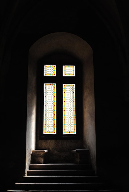Photo inside corvins castle with stained glass