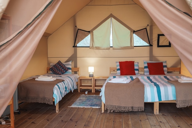 The inside of a glamping tent. Luxury tent inside.