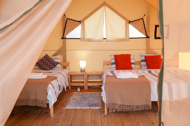 The inside of a glamping tent. Luxury tent inside.