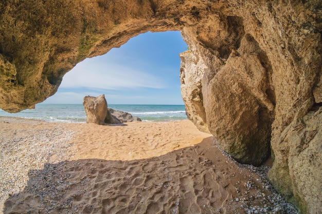 Inside of grotto at day on the sea shore