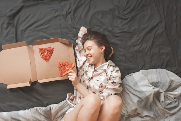 Inside the portrait of a happy girl in pajamas