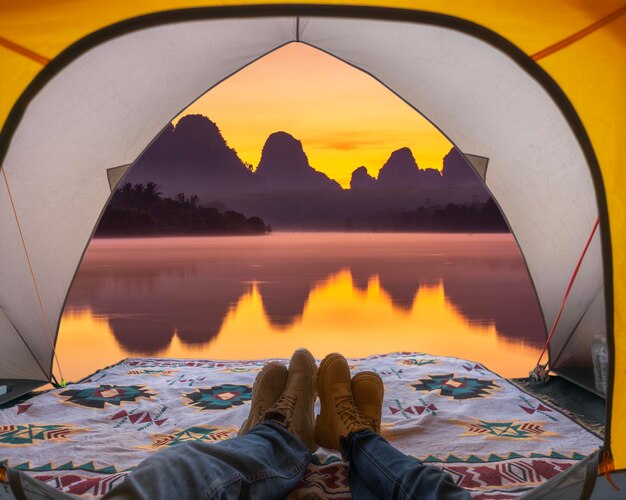 Photo inside tent and camping of morning sunrise and nature in krabi with mountain and the river thailand