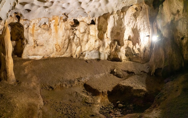 Inside view of Karain Cave in Antalya, with natural stalactites and stalagmites around in Turkey