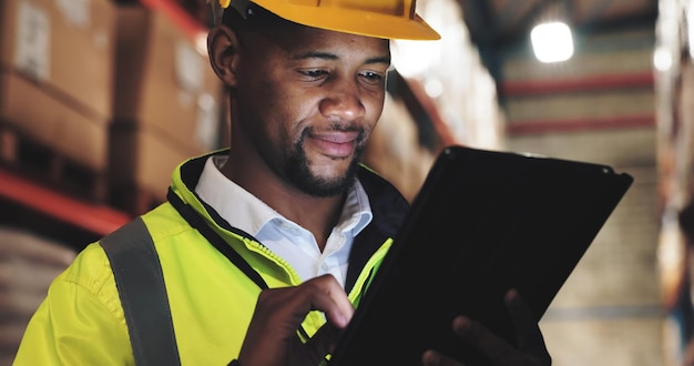 inspection black man or tablet in logistics for checklist distribution or stock management supply chain employee or supervisor with tech for shipping orders quality control or warehouse at night