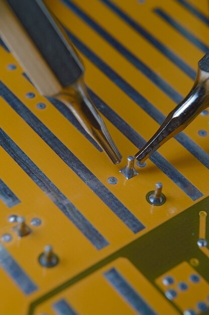 Inspection and repair of contacts on the motherboard microcircuit. macro.