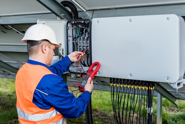 Photo the inspector checks the actual output voltage level of inverter