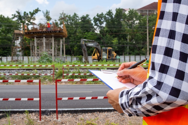 Inspectors or engineers are examining the construction of public roads in communities.