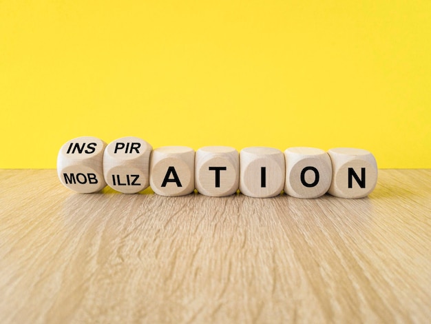 Photo inspiration or mobilization symbol concept words inspiration and mobilization on wooden cubes