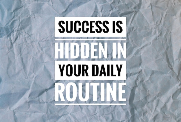 Photo inspirational quote with phrase success is hidden in your daily routine