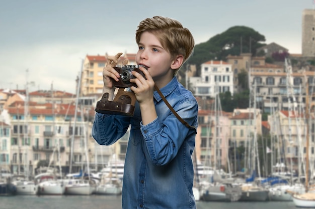 Inspired american little boy with camera