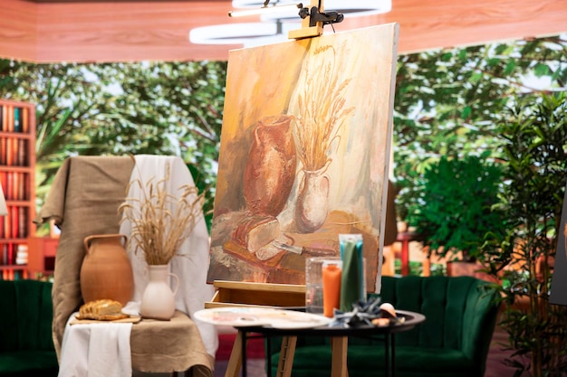 inspired artist works on a canvas to create a masterpiece in atelier
