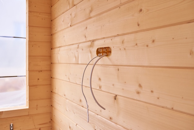 Installation of electrical wiring inside a wooden house