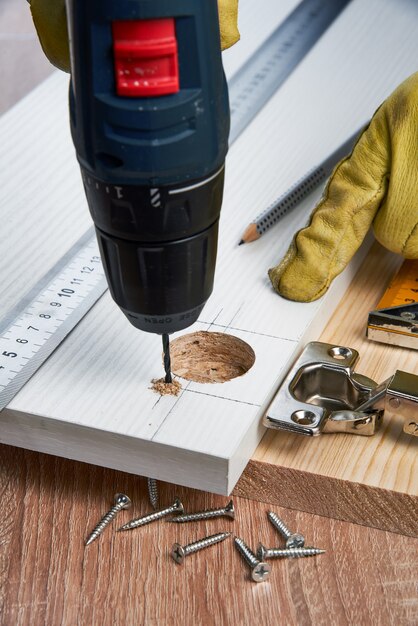 Installation of furniture hinges in the chipboard tools and accessories