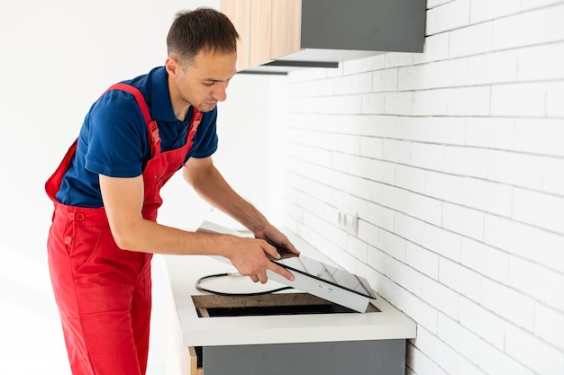 Installation of induction stove or cooktop by a master.