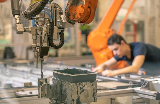 Installation of new robot arms in the factory for modernization of production