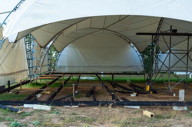 Installation of plywood floors inside a large event tent