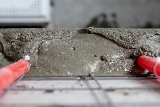 Installation of polypropylene pipes for underfloor heating systems pouring the floor with concrete