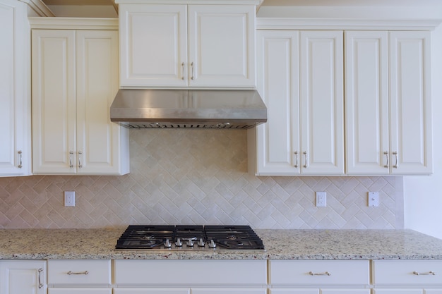 Photo installing new induction hob in modern kitchen