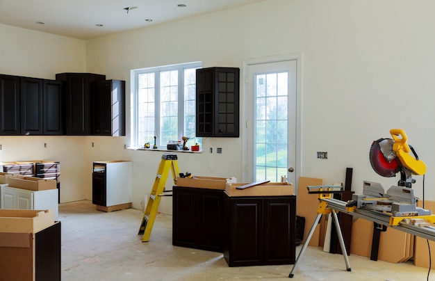 Photo installing new induction hob in modern kitchen