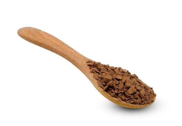 Instant coffee powder with wooden spoon isolated on white background