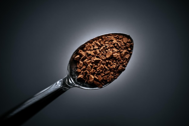 Photo instant coffee on a spoon with a blurred background