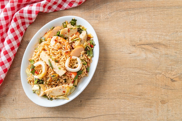 Instant noodle spicy salad with mixed meats