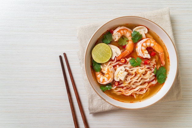 instant noodles ramen in spicy soup with shrimps (Tom Yum Kung) - Asian food style