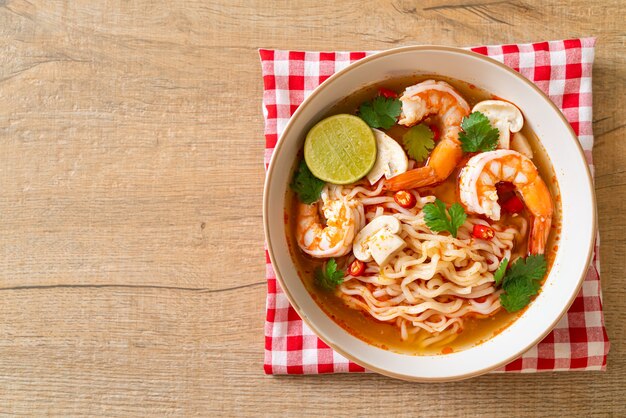 instant noodles ramen in spicy soup with shrimps (Tom Yum Kung) - Asian food style
