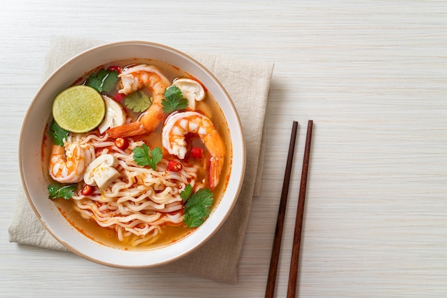 instant noodles ramen in spicy soup with shrimps (Tom Yum Kung) - Asian food style