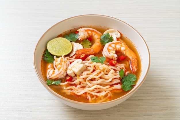 instant noodles ramen in spicy soup with shrimps (Tom Yum Kung)
