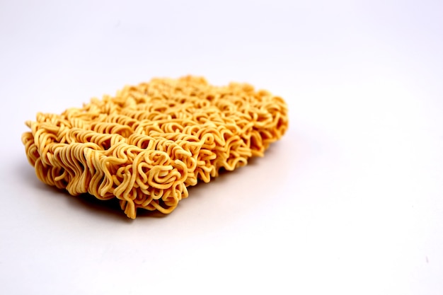 Instant noodles on a white backdrop.