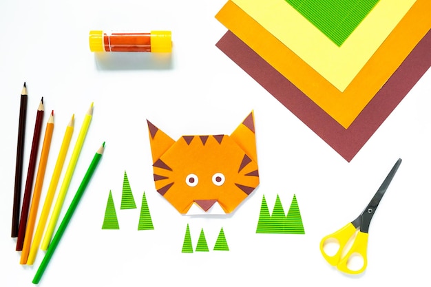 Instruction step by step origami tiger. Children's craft