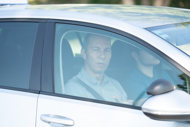 Instructor Driver in His Car