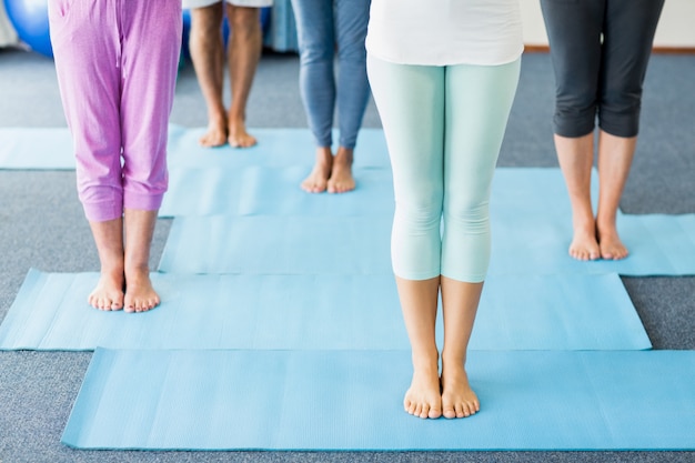 Instructor performing yoga with seniors