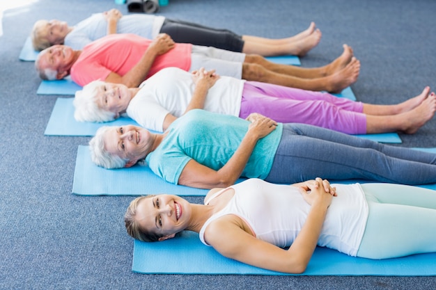 Instructor performing yoga with seniors