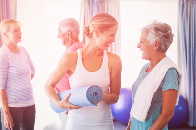 Instructor standing together with seniors