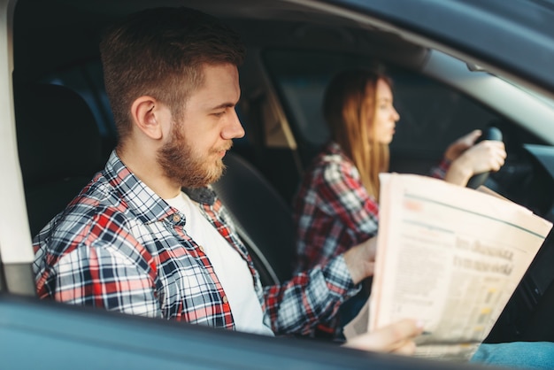 Instructor taking the exam, female student drives