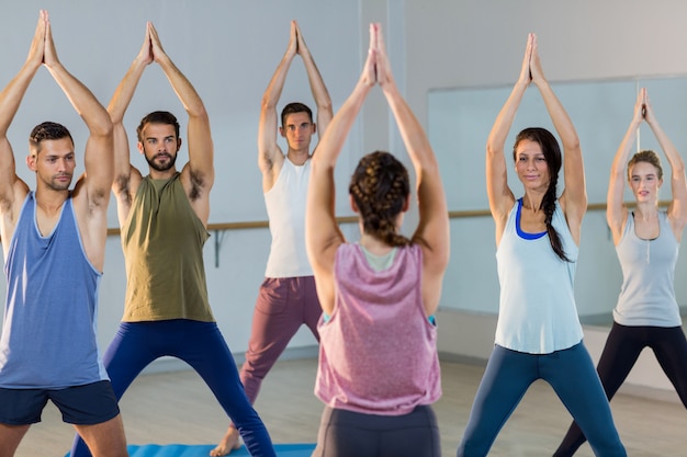 Instructor taking yoga class