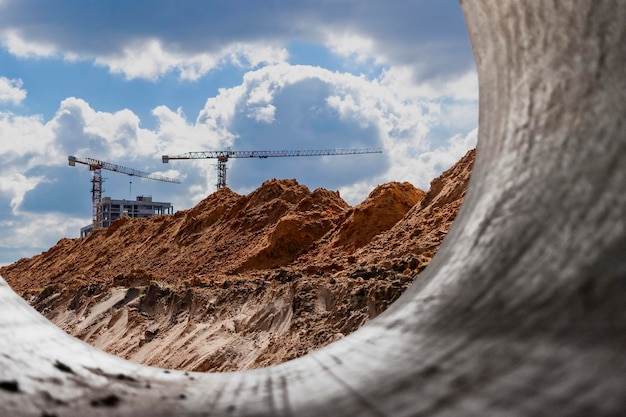 Insulated pipe Large metal pipes with a plastic sheath laid in a trench Modern pipeline for supplying hot water and heating to a residential area