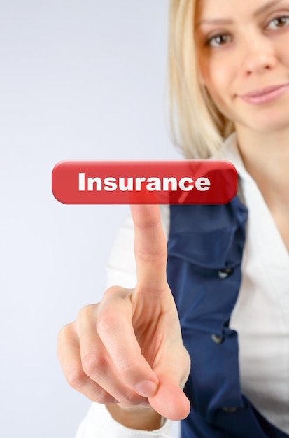 Photo insurance concept. business woman presses the button insurance